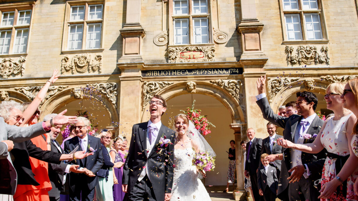 bride and groom showered in confetti