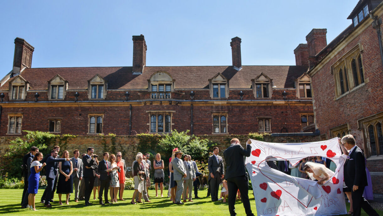 bride cutting out heart shape from a huge sheet