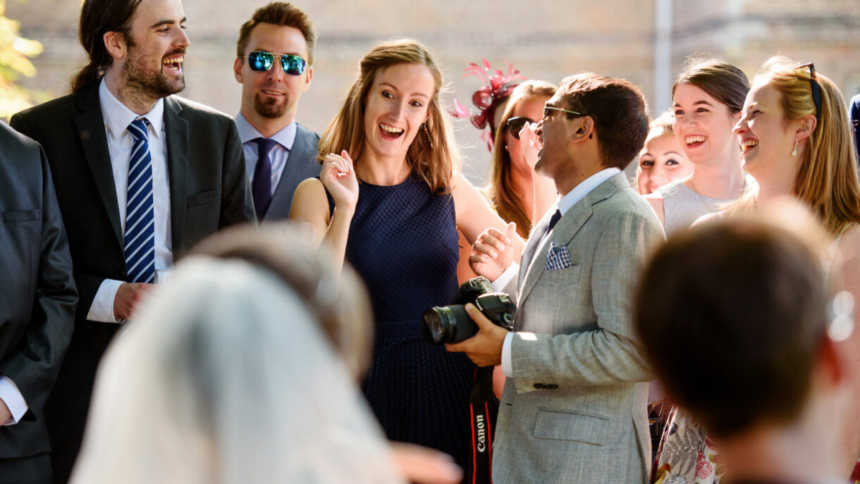 guests at a wedding laughing