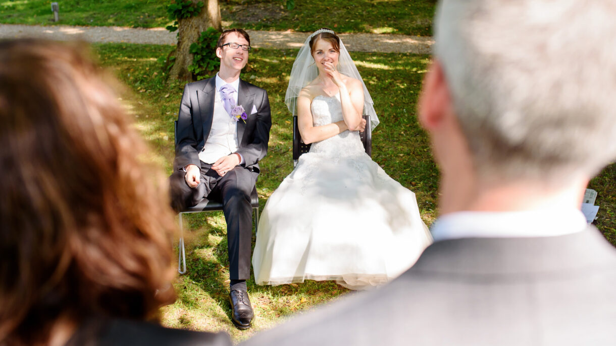 bride and groom sitting down