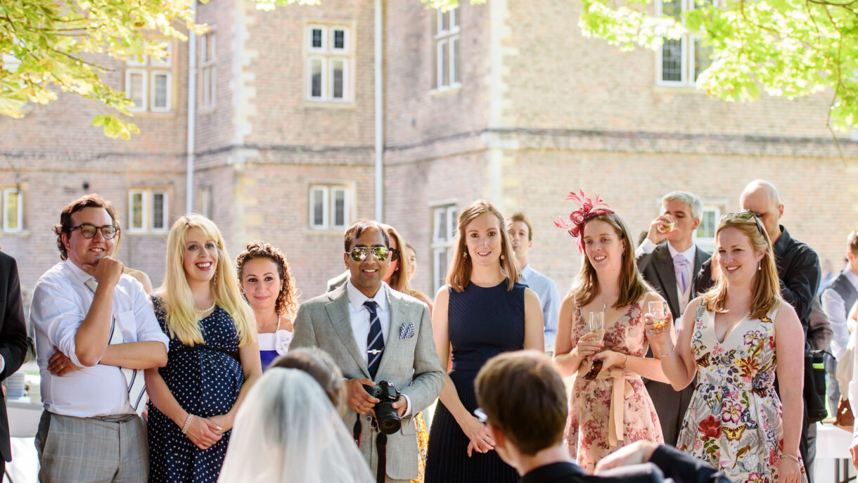 guests at a wedding laughing