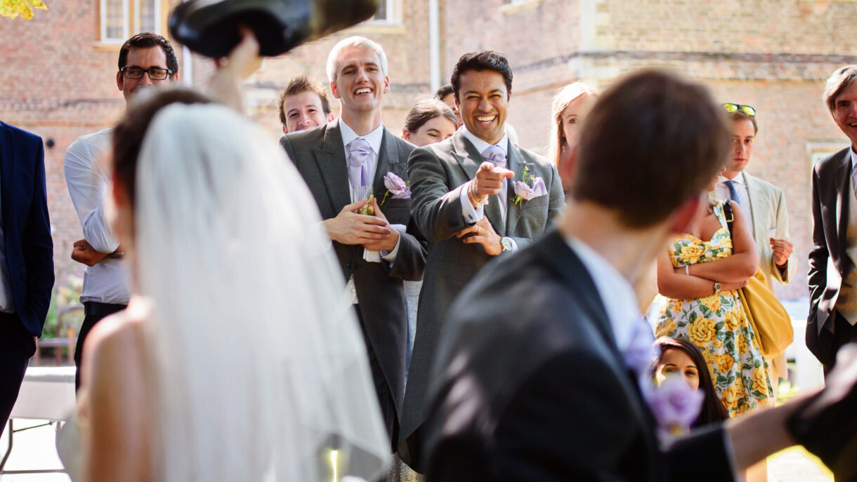 guests at a wedding laughing