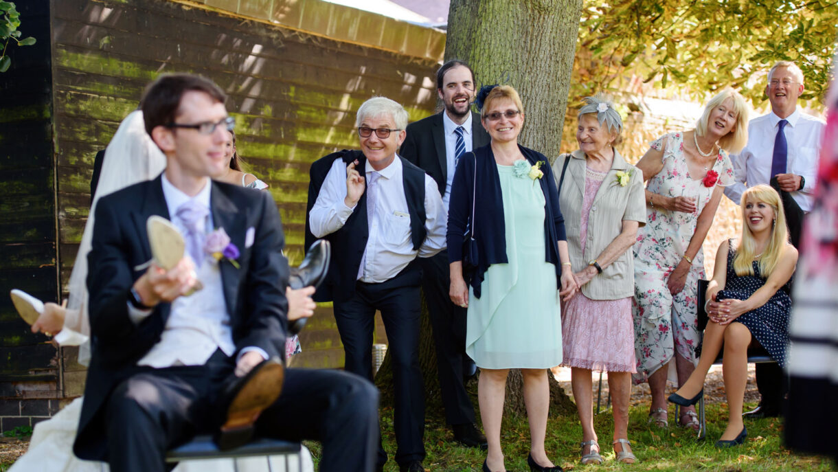 guests at a wedding laughing
