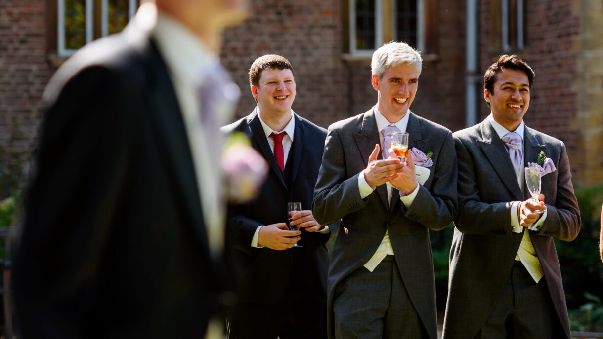 guests at a wedding laughing