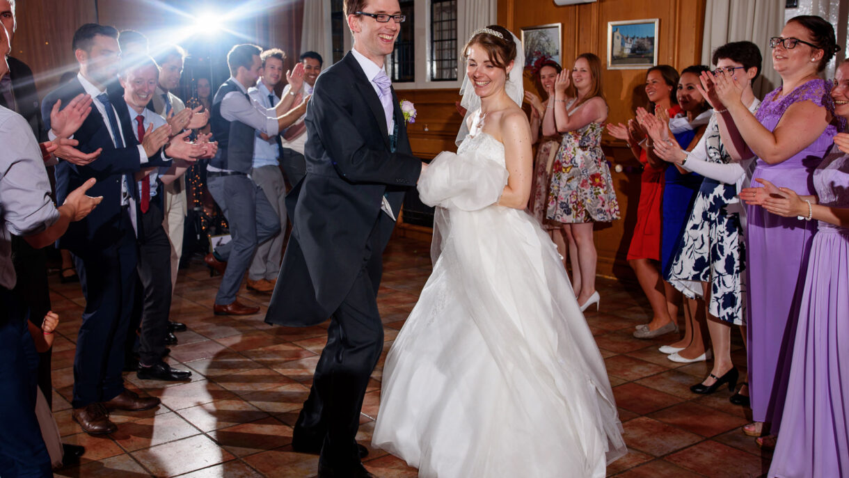 bride and groom doing a ceilidh wedding dance