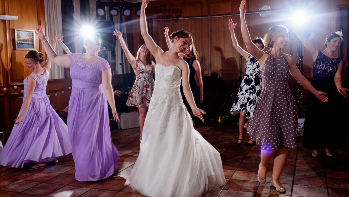 bride and bridesmaids dancing