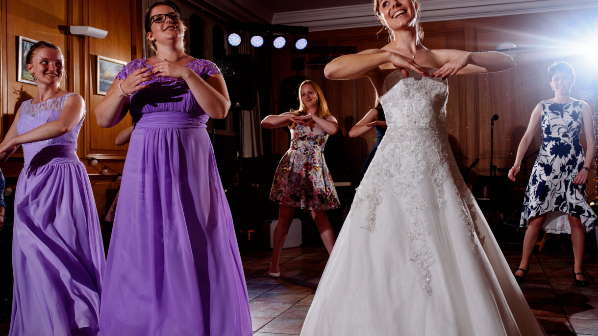 bride and bridesmaids dancing
