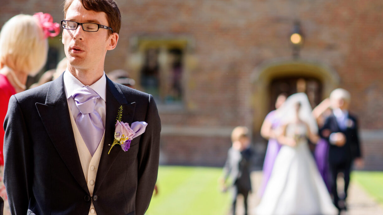 groom awaiting bride at the isle